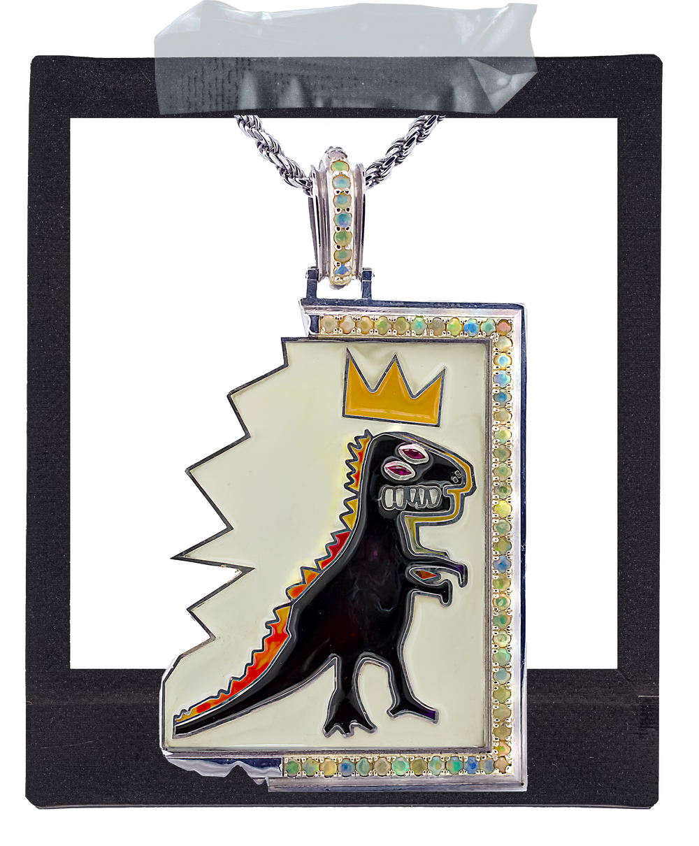 A rectangular pendant necklace with a silver-tone chain, featuring a black dinosaur design with red and orange accents, a gold crown, and opal stones trim on a white background.